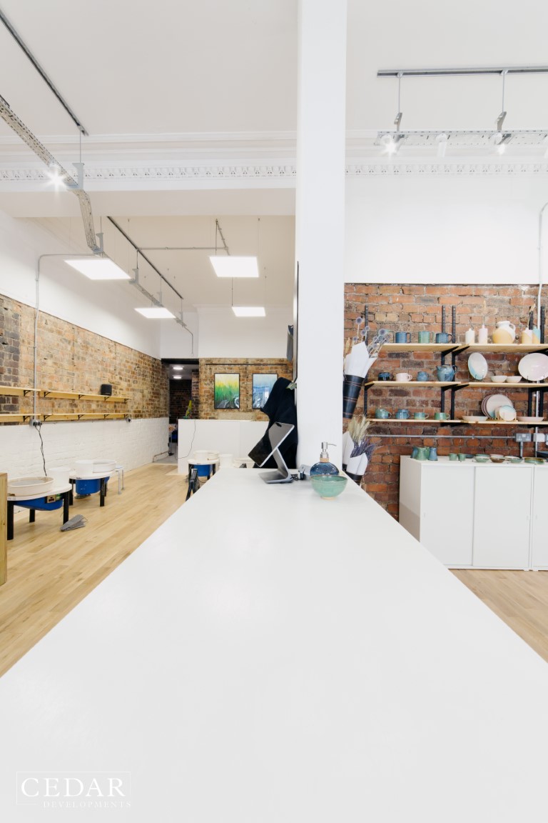 edinburgh-pottery-shop-renovation-main-shop-bright-lights-work-table