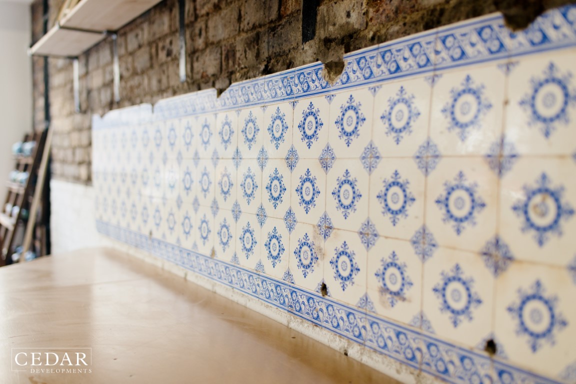 edinburgh-pottery-shop-renovation-original-tiles-found-behind-wall