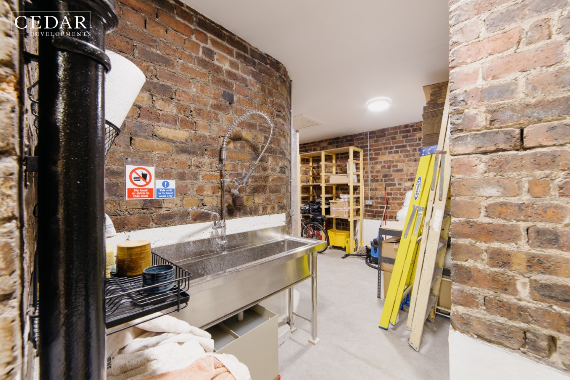 edinburgh-pottery-shop-sink-area-with-back-to-oirginal-brickwork-walls